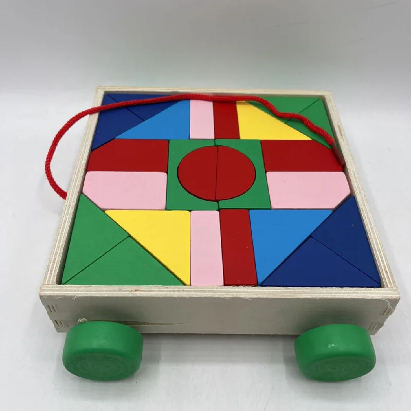eco-conscious wooden toys that promote sustainability                   Wooden Geometric Shaped Blocks in Pull-Along Wagon